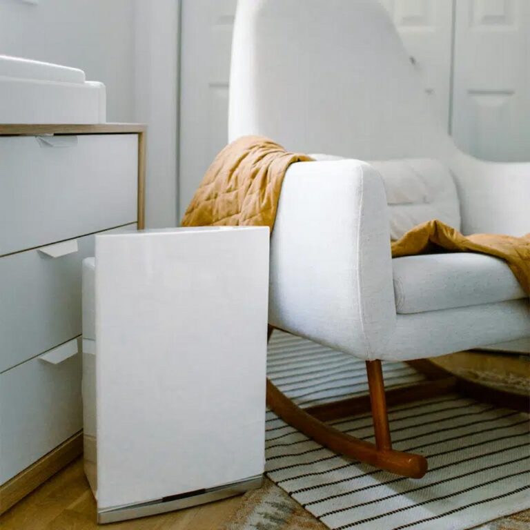 Compact Air Purifier next to white chair