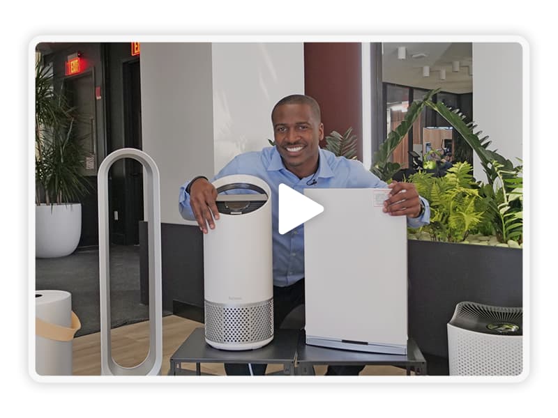 Man comparing Air Purifiers